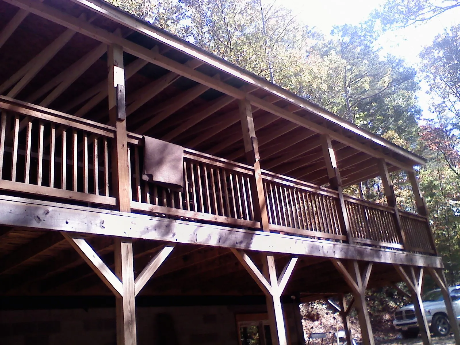 Timber framing under a new elevated porch and deck — Roof Leak Repair in La Grande by Roofing Brothers